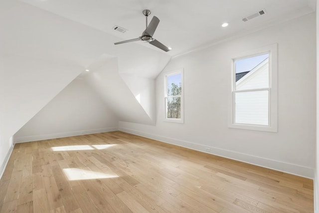 bonus room featuring vaulted ceiling, light hardwood / wood-style floors, and ceiling fan