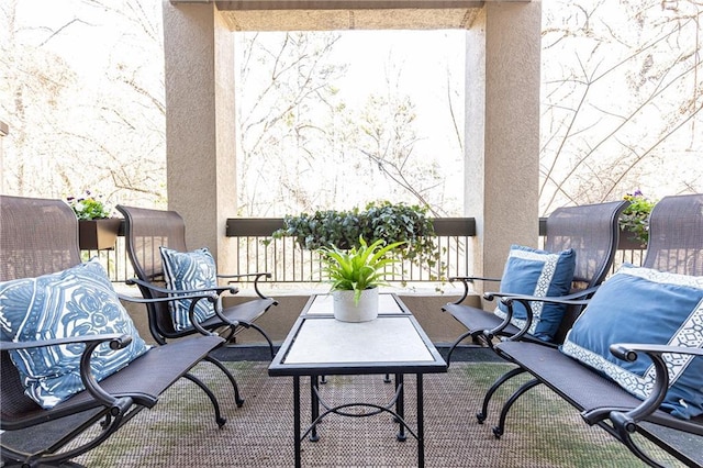 view of patio / terrace with a balcony