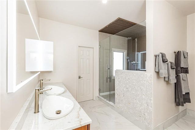 bathroom featuring vanity and an enclosed shower