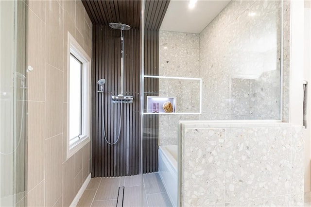 bathroom with tile patterned floors and walk in shower