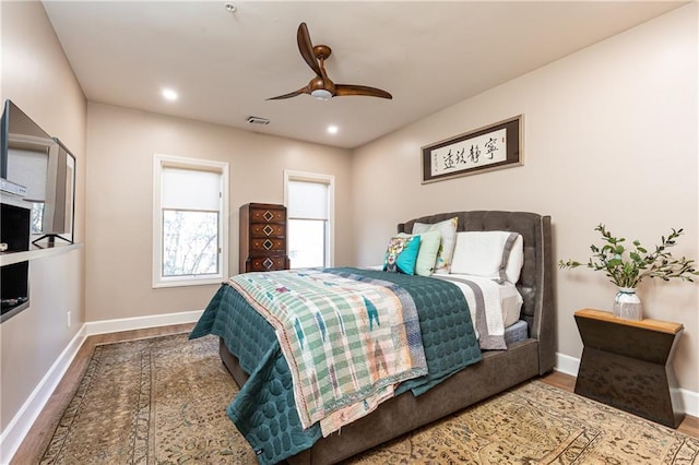 bedroom with ceiling fan and hardwood / wood-style floors