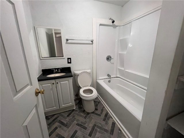 full bathroom with toilet, shower / tub combination, brick floor, a textured wall, and vanity