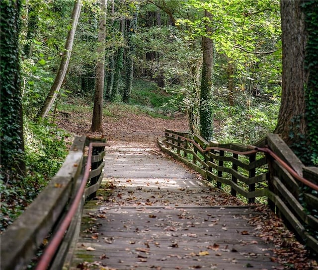 surrounding community featuring a wooded view