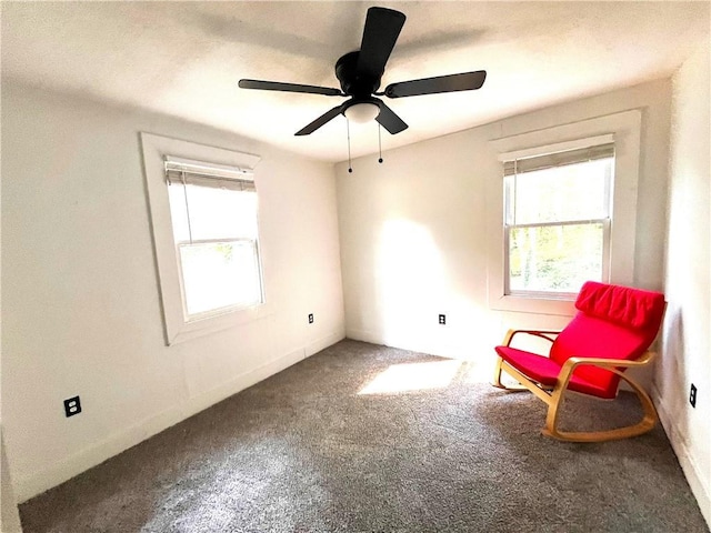 unfurnished room with baseboards, carpet, and a ceiling fan