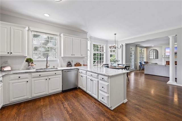 2500 Ashbourne Dr, Lawrenceville, GA 30043 - kitchen with dishwasher, a peninsula, a chandelier, open floor plan, and ornamental molding