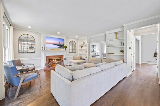 2500 Ashbourne Dr, Lawrenceville, GA 30043 - living area featuring crown molding, a fireplace, recessed lighting, plenty of natural light, and dark wood-style flooring