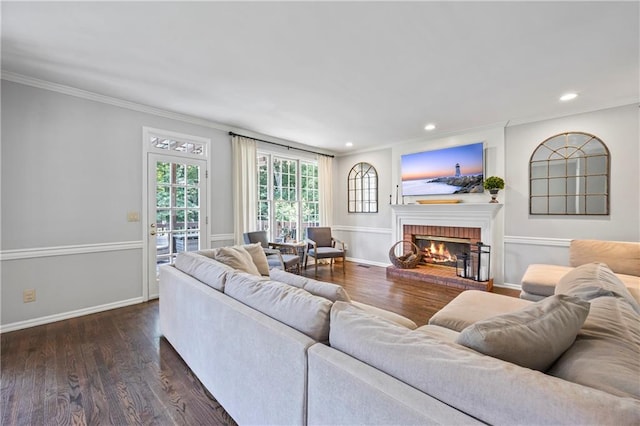2500 Ashbourne Dr, Lawrenceville, GA 30043 - living area with ornamental molding, a fireplace, dark wood-style floors, and recessed lighting