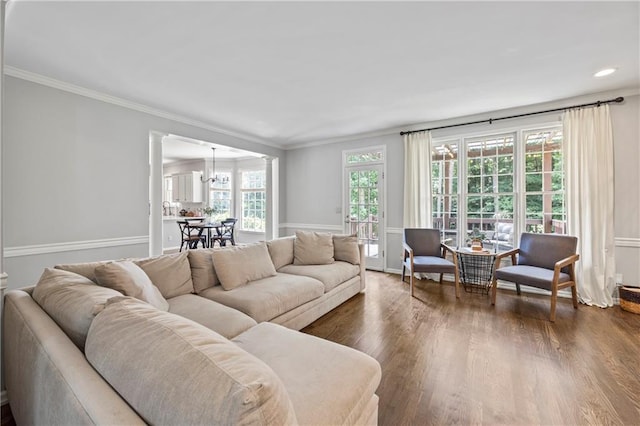 2500 Ashbourne Dr, Lawrenceville, GA 30043 - living room with dark wood-style flooring, ornate columns, ornamental molding, a chandelier, and recessed lighting