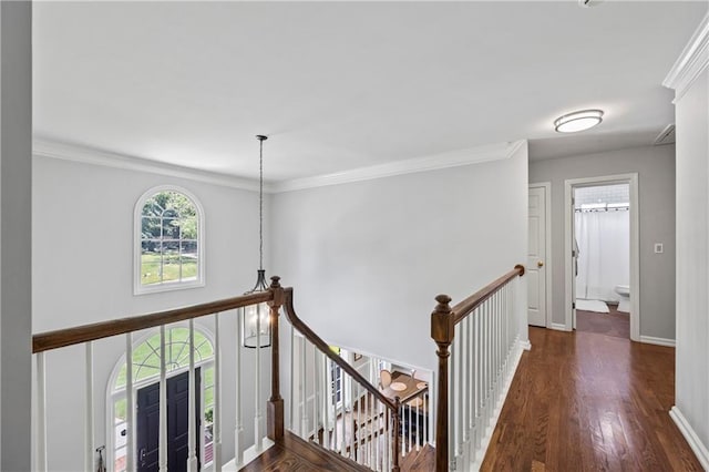 2500 Ashbourne Dr, Lawrenceville, GA 30043 - hallway with an upstairs landing, wood finished floors, and crown molding