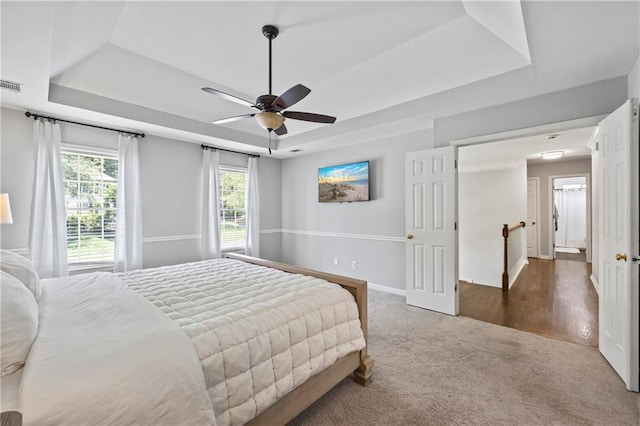 2500 Ashbourne Dr, Lawrenceville, GA 30043 - carpeted bedroom with a raised ceiling and a ceiling fan
