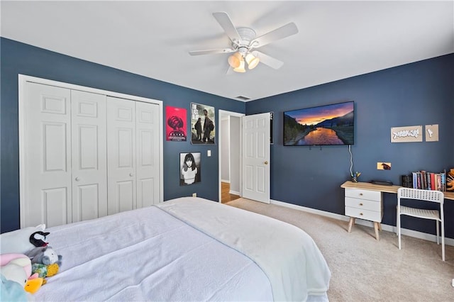 2500 Ashbourne Dr, Lawrenceville, GA 30043 - carpeted bedroom with a closet and a ceiling fan