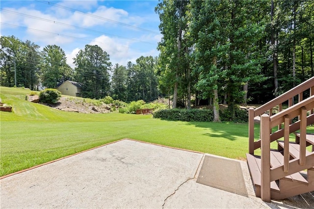 2500 Ashbourne Dr, Lawrenceville, GA 30043 - view of green lawn featuring a patio and view of wooded area
