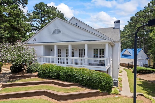 2500 Ashbourne Dr, Lawrenceville, GA 30043 - view of front of home with a chimney, covered porch, and a front yard