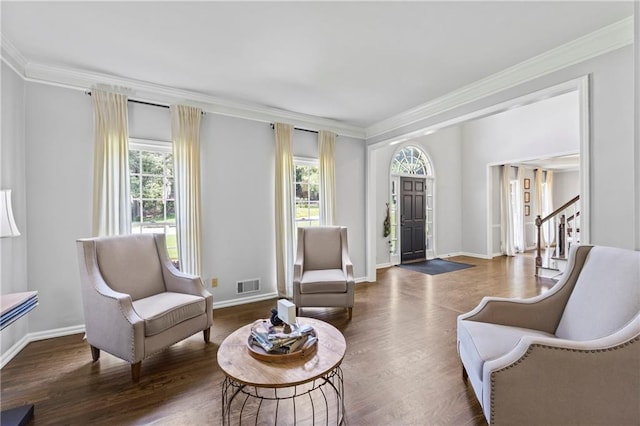2500 Ashbourne Dr, Lawrenceville, GA 30043 - living area featuring plenty of natural light, ornamental molding, and wood finished floors