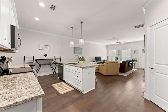 kitchen with a ceiling fan, a sink, white cabinetry, visible vents, and appliances with stainless steel finishes