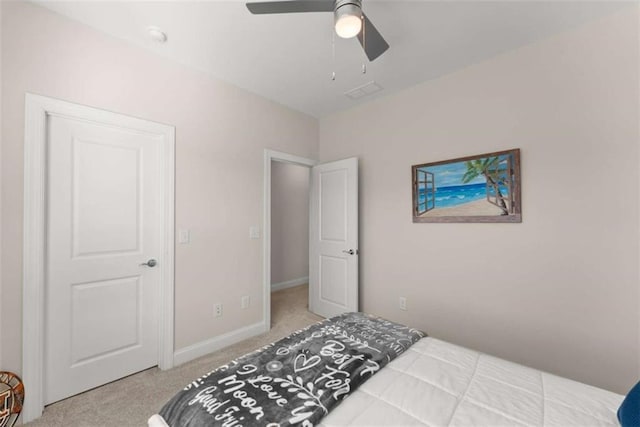 bedroom featuring carpet, visible vents, baseboards, and a ceiling fan