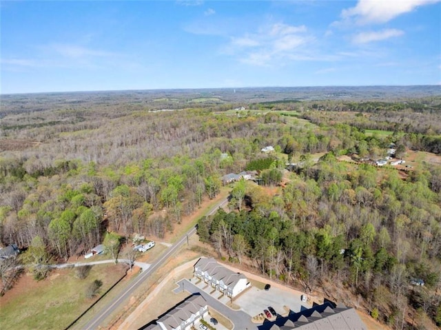 bird's eye view featuring a forest view