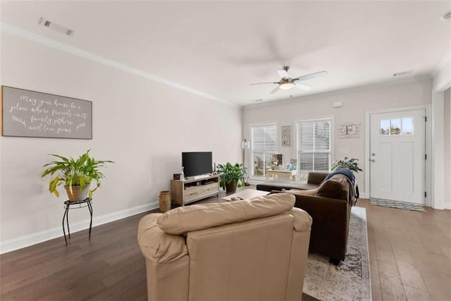 living room featuring hardwood / wood-style floors, visible vents, crown molding, a ceiling fan, and baseboards