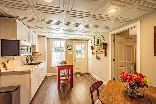 6369 Timber Creek Trl, Dahlonega, GA 30533 - kitchen with an ornate ceiling, white cabinets, dark wood-type flooring, stainless steel microwave, and light stone countertops