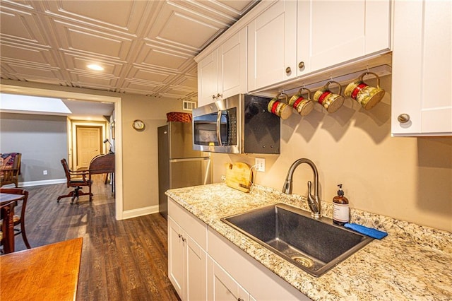 6369 Timber Creek Trl, Dahlonega, GA 30533 - kitchen with stainless steel microwave, fridge, an ornate ceiling, white cabinetry, and dark wood finished floors