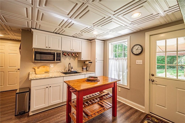 6369 Timber Creek Trl, Dahlonega, GA 30533 - kitchen featuring stainless steel microwave, an ornate ceiling, white cabinetry, dark wood finished floors, and recessed lighting