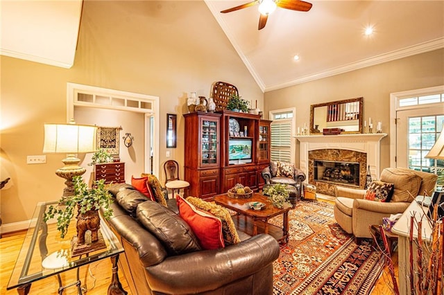 6369 Timber Creek Trl, Dahlonega, GA 30533 - living area featuring wood finished floors, a ceiling fan, a fireplace, crown molding, and high vaulted ceiling