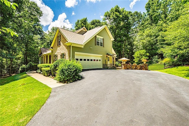 6369 Timber Creek Trl, Dahlonega, GA 30533 - view of side of property featuring driveway, a garage, roof with shingles, and brick siding