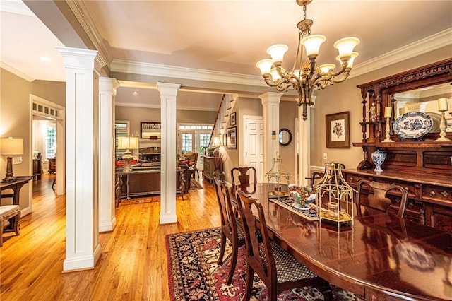 6369 Timber Creek Trl, Dahlonega, GA 30533 - dining space with ornate columns, light wood-type flooring, and ornamental molding