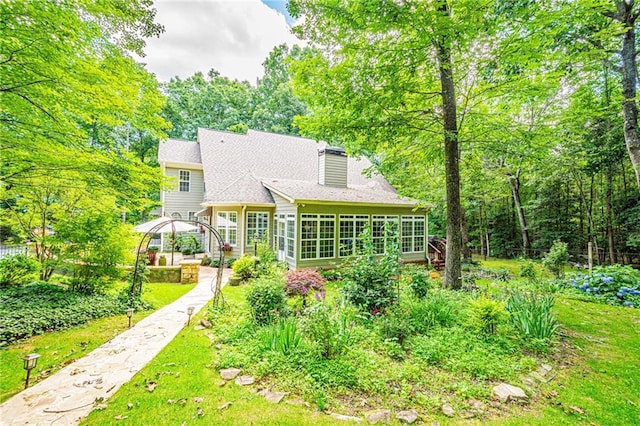 6369 Timber Creek Trl, Dahlonega, GA 30533 - rear view of property featuring a sunroom, a yard, and a chimney