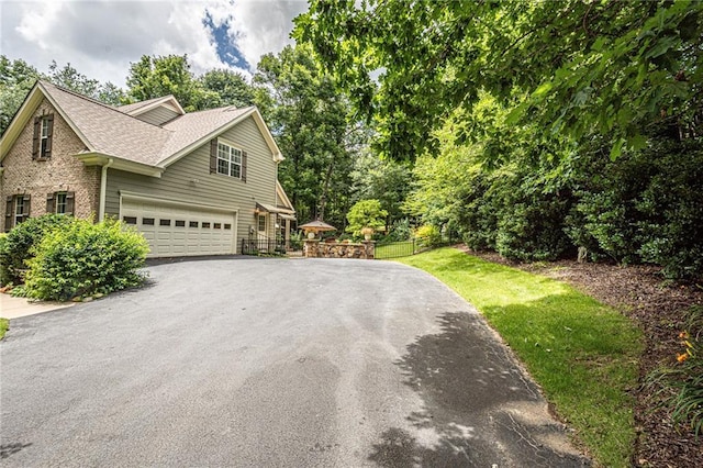 6369 Timber Creek Trl, Dahlonega, GA 30533 - view of home's exterior featuring driveway, an attached garage, and roof with shingles