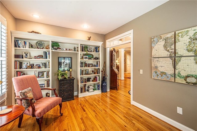 6369 Timber Creek Trl, Dahlonega, GA 30533 - sitting room featuring light wood-type flooring and decorative columns
