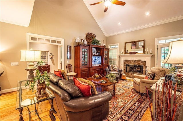 6369 Timber Creek Trl, Dahlonega, GA 30533 - living area with ornamental molding, wood finished floors, a ceiling fan, a fireplace, and high vaulted ceiling