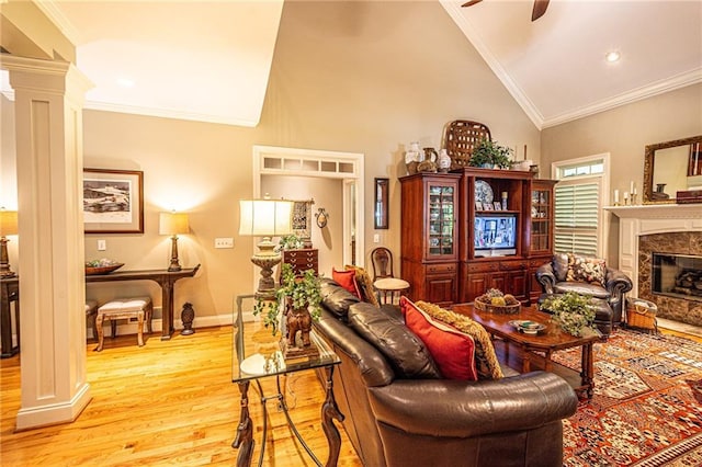 6369 Timber Creek Trl, Dahlonega, GA 30533 - living area with light wood-type flooring, decorative columns, ceiling fan, a fireplace, and ornamental molding