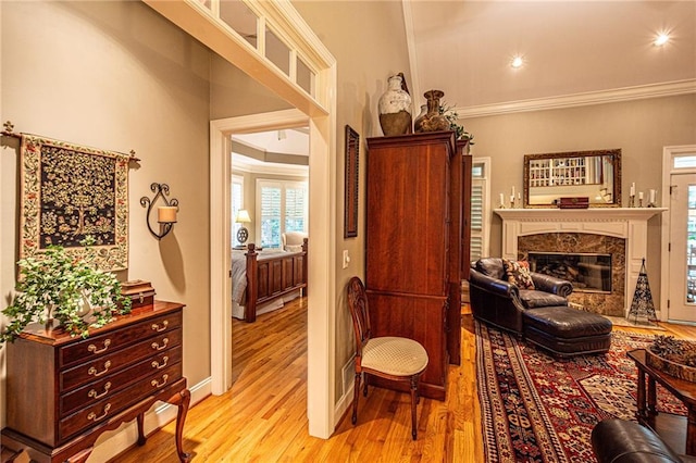 6369 Timber Creek Trl, Dahlonega, GA 30533 - living area featuring light wood-type flooring, a premium fireplace, ornamental molding, and recessed lighting