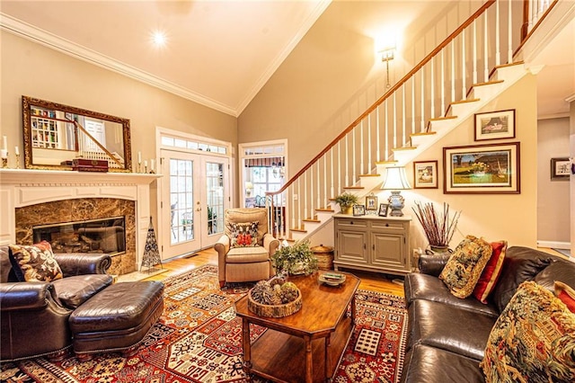 6369 Timber Creek Trl, Dahlonega, GA 30533 - living area featuring wood finished floors, stairs, ornamental molding, high vaulted ceiling, and a high end fireplace