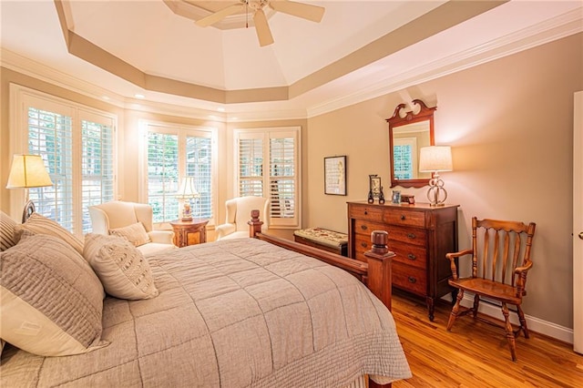 6369 Timber Creek Trl, Dahlonega, GA 30533 - bedroom featuring wood finished floors, a ceiling fan, ornamental molding, and a raised ceiling