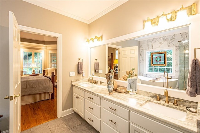 6369 Timber Creek Trl, Dahlonega, GA 30533 - ensuite bathroom featuring crown molding, plenty of natural light, double vanity, a freestanding tub, and tile patterned floors