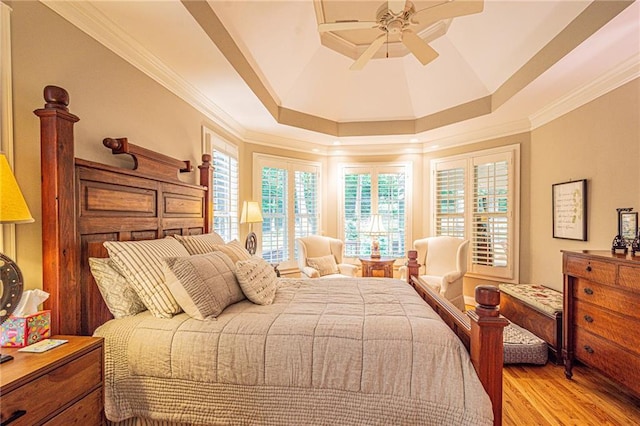 6369 Timber Creek Trl, Dahlonega, GA 30533 - bedroom featuring a tray ceiling, light wood-style flooring, ornamental molding, and ceiling fan