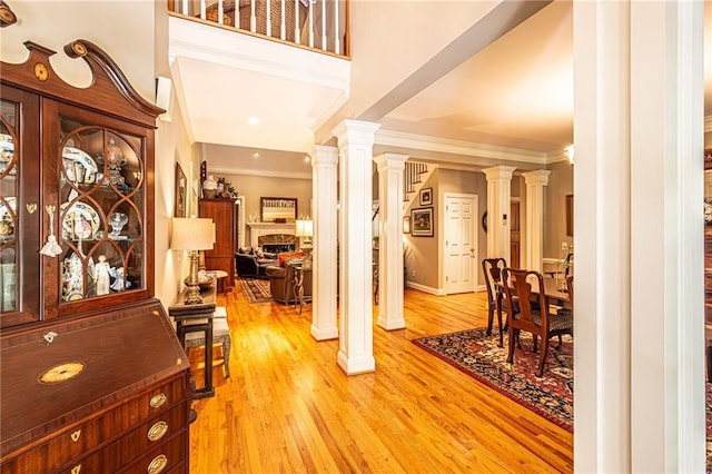 6369 Timber Creek Trl, Dahlonega, GA 30533 - entrance foyer featuring ornamental molding, ornate columns, light wood-type flooring, and recessed lighting