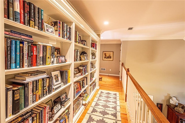 6369 Timber Creek Trl, Dahlonega, GA 30533 - corridor featuring crown molding, wood finished floors, and an upstairs landing