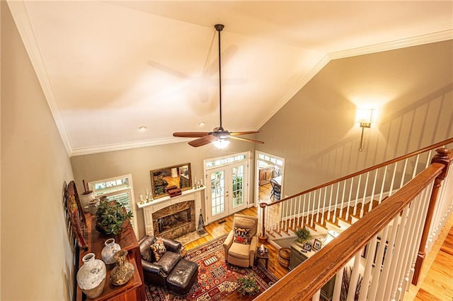 6369 Timber Creek Trl, Dahlonega, GA 30533 - living room with wood finished floors, ornamental molding, a ceiling fan, stairs, and a high end fireplace