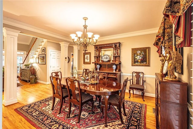 6369 Timber Creek Trl, Dahlonega, GA 30533 - dining room with ornamental molding, a chandelier, decorative columns, light wood-type flooring, and stairway