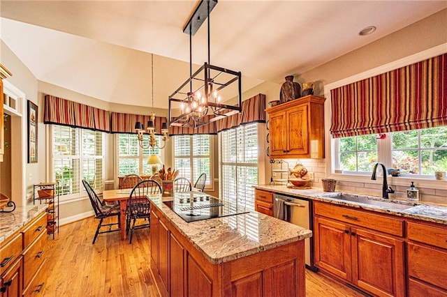 6369 Timber Creek Trl, Dahlonega, GA 30533 - kitchen featuring black electric cooktop, brown cabinets, stainless steel dishwasher, a center island, and a chandelier