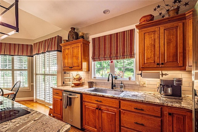 6369 Timber Creek Trl, Dahlonega, GA 30533 - kitchen featuring stainless steel dishwasher, light wood-style floors, light stone countertops, and lofted ceiling