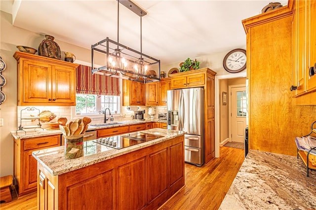 6369 Timber Creek Trl, Dahlonega, GA 30533 - kitchen with stainless steel fridge with ice dispenser, black electric stovetop, a center island, and backsplash