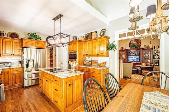 6369 Timber Creek Trl, Dahlonega, GA 30533 - kitchen featuring a chandelier, appliances with stainless steel finishes, backsplash, and a kitchen island