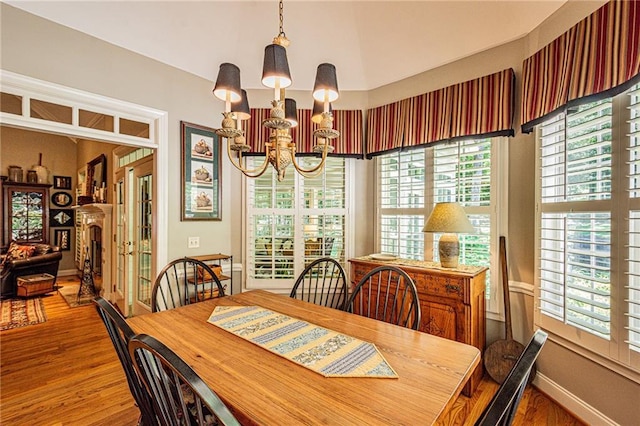 6369 Timber Creek Trl, Dahlonega, GA 30533 - dining area with a chandelier, wood finished floors, and plenty of natural light
