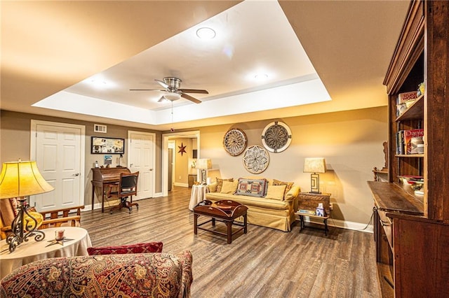 6369 Timber Creek Trl, Dahlonega, GA 30533 - living area with a tray ceiling, wood finished floors, and a ceiling fan