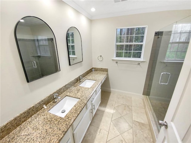 bathroom with vanity, plenty of natural light, a shower with shower door, and crown molding