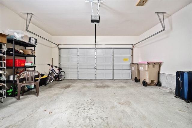 garage featuring a garage door opener